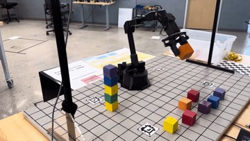 Robot arm stacking colored blocks